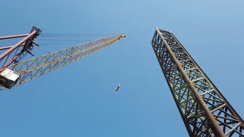 Jack up rig leg and a crane in a shipyard Stock Footage 116495885