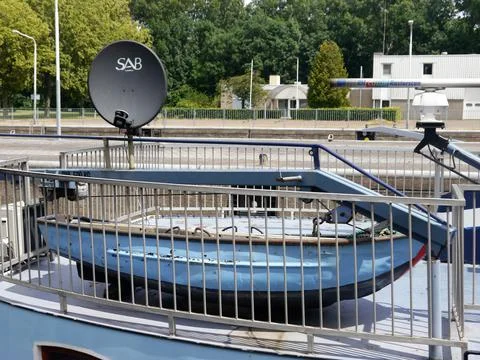 Jacked up dinghy and folded down radar mast Stock Photos