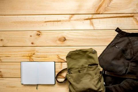 Jacket and shoulder bag with notebook Stock Photos