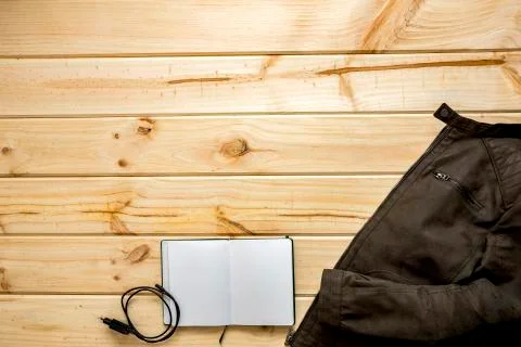 Jacket and shoulder bag with notebook Stock Photos