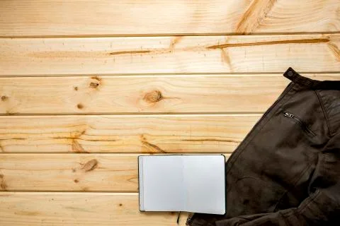 Jacket and shoulder bag with notebook Stock Photos