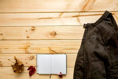 Jacket and shoulder bag with notebook Stock Photos