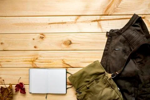 Jacket and shoulder bag with notebook Stock Photos