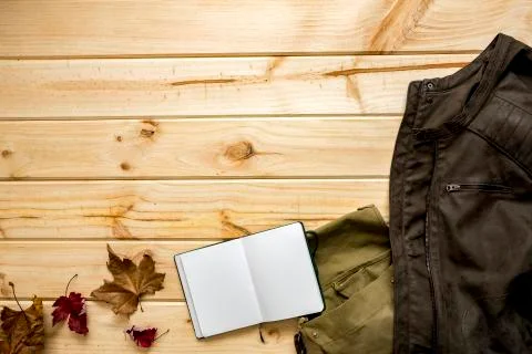 Jacket and shoulder bag with notebook Stock Photos