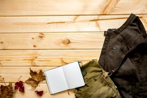 Jacket and shoulder bag with notebook Stock Photos