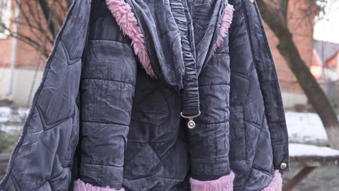 A jacket is drying on a string frozen Stock Footage 314276813