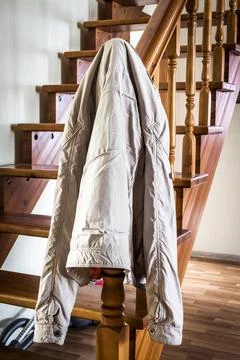 The jacket is hanging on the stairs Stock Photos