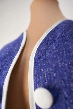 Jacket lapel in blue wool with white applications. women's formal clothing Stock Photos