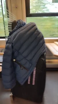 Jacket on suitcase Stock Photos