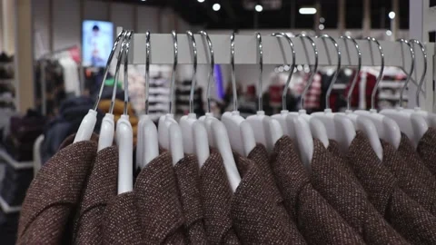 Jackets on a hanger in a row. 스톡 동영상 219351442