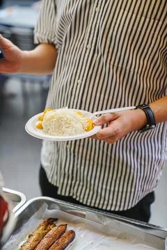 Jackfruit milk sticky rice held by a customer who has already purchased it Stock Photos