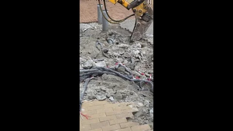 Jackhammer Breaking Concrete Exposing Underground Cables Road Construction Stock Footage 341618822