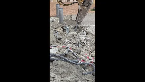 Jackhammer Breaking Concrete Exposing Underground Cables Road Construction Stock Footage 341618832
