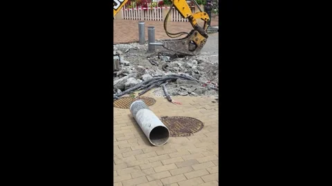 Jackhammer Breaking Concrete Exposing Underground Cables Road Construction Stock Footage 341618843