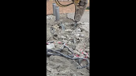 Jackhammer Breaking Concrete Exposing Underground Cables Road Construction Stock Footage 341618845