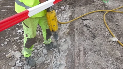 Jackhammer Breaking Concrete Pavement During Road Reconstruction Stock Footage 344440113