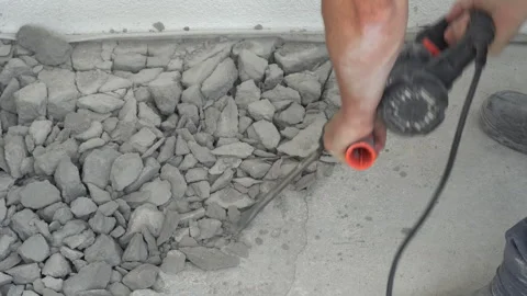 The jackhammer breaks the cement screed. Work with a perforator Stock Footage 244051071