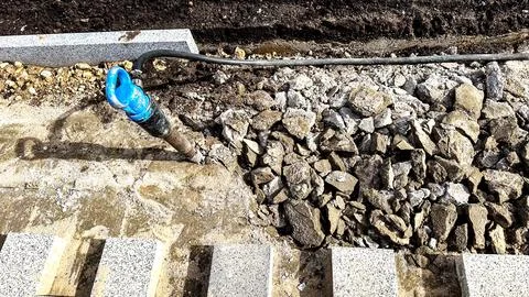 Jackhammer in broken footpath Stock-Fotos