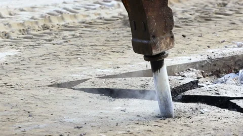 Jackhammer machine digging up concrete road Stock Footage 45599735