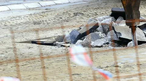 Jackhammer machine digging up concrete road Stock Footage 58910947