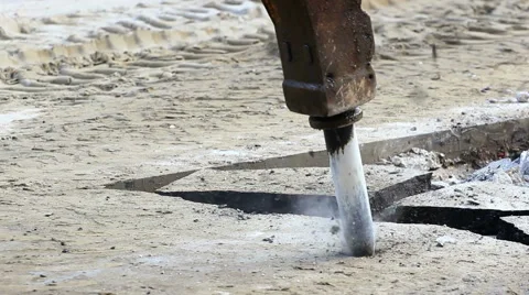 Jackhammer machine digging up concrete road Stock-Footage 58911044
