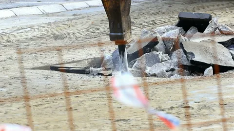 Jackhammer machine digging up concrete road Stock Footage 58911071