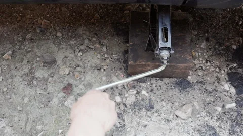 Jacking up the car for wheel repair Stock Footage 156541940
