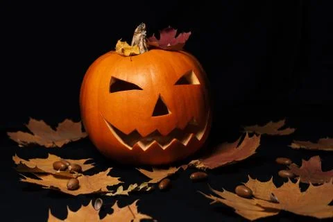 Jack's lantern on a black background. Festive pumpkin for Halloween Stock Photos