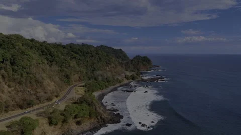 Jaco Beach Costa Rica Cliffs &amp; Rocky Coastline, Pacific Ocean Aerial View Video stock 331253559
