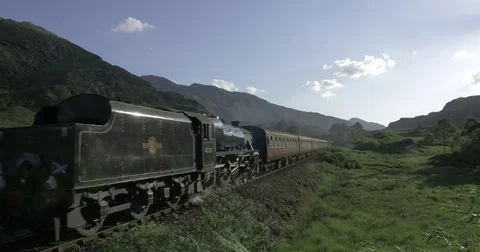 Jacobite Steam Train Passing Through Scottish Highlands Video stock 81186077