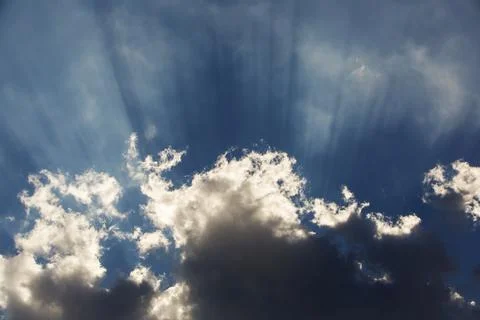 Jacobs ladders shining out of a cloud over Leicestershire, UK. Stock Photos
