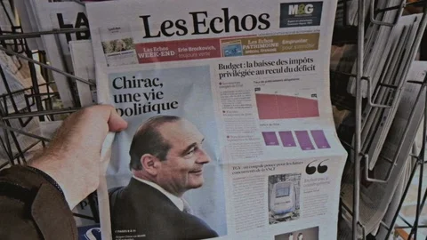 Jacques Chirac on cover of newspaper at press kiosk Stock Footage 128716474