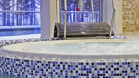 Jacuzzi among swimming pool with SPA Stock Footage 73120633