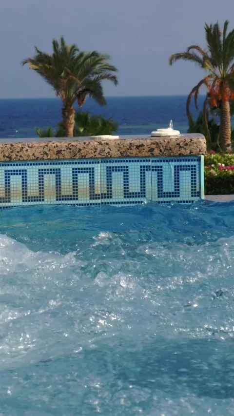 Jacuzzi. close-up. bubbling water in the open jacuzzi, pool. tropical resort, by Stock Footage 309096258