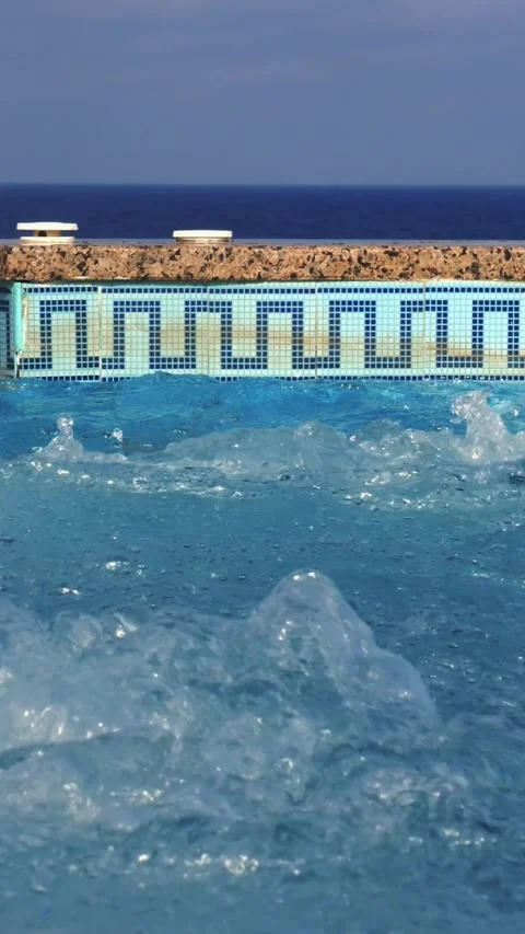 Jacuzzi. close-up. bubbling water in the open jacuzzi, pool. tropical resort, by Stock Footage 318727599