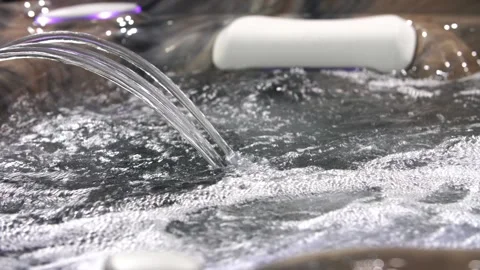 Jacuzzi jet of blue water with bubbles 库存影片 88561051