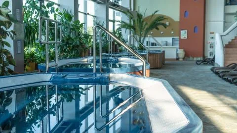 Jacuzzi small pool brown sun loungers Standing water hydromassage shooting in Stock Photos
