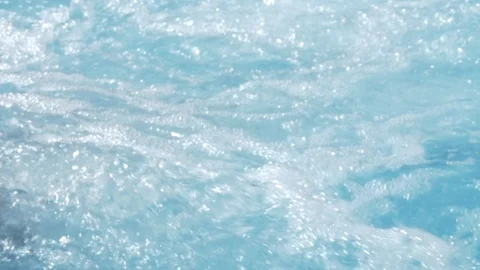 Jacuzzi water bubbles float about in waves. Stock Footage 114417736
