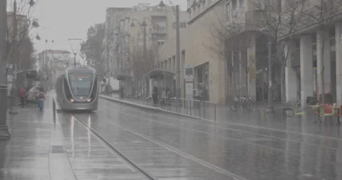 Jaffa Street and the Light Rail on a rainy day in Jerusalem, Israel Stock Footage 137352157