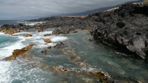 Jagged Basalt Coastline and Tidal Pools with Waves, Buenavista del Norte Stock Footage 346002972