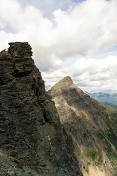Jagged mountain peaks and cloudscape Stock Photos