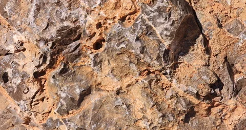 Jagged multi-color Rock Close-Up slider with Diffused Sunlight Video stock 313838465