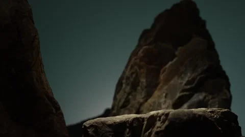 Jagged rock peaks lit in dramatic indoor setting with copy space Stock Footage 312517223