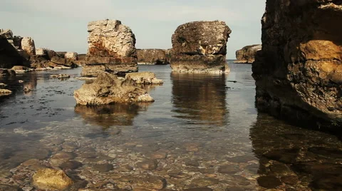 Jagged rocks , the sea and the waves Stock Footage 57395660