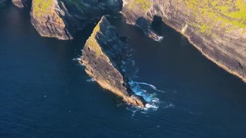 Jagged Sea Stack Off Sheer Atlantic Headland, Aerial Coastal Fly Past Stock Footage 342736583