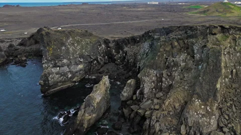 Jagged volcanic rock cliffs by the sea, South Iceland. Stock Footage 315121434