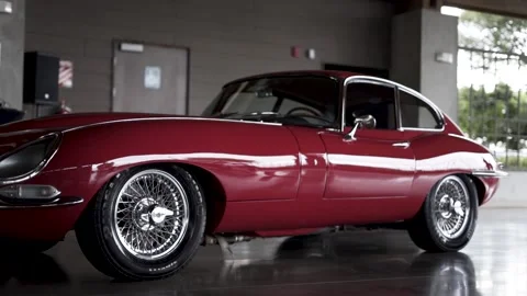 Jaguar E-Type antique english car jagaur red  on display Video stock 156947878