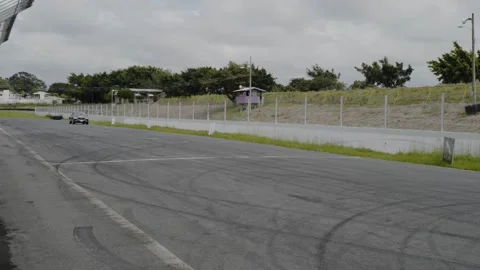 Jaguar i pace gray electric on race track Stock Footage 155606363