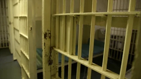 Jail cell and hallway in old prison Stock Footage 77041906