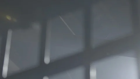 Jail Cell Bars with Sunlight Streaming Through HD Video Stock Footage 90386202